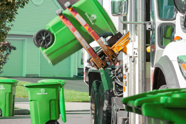 Reliable Garbage Removal Services in Kent, WA – A Complete Guide Automated garbage removal services Kent WA using trucks to lift green recycling bins for eco-friendly disposal.