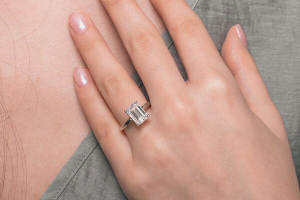 Combining old soul and modern edge in emerald cut engagement rings emerald cut moissanite ring
